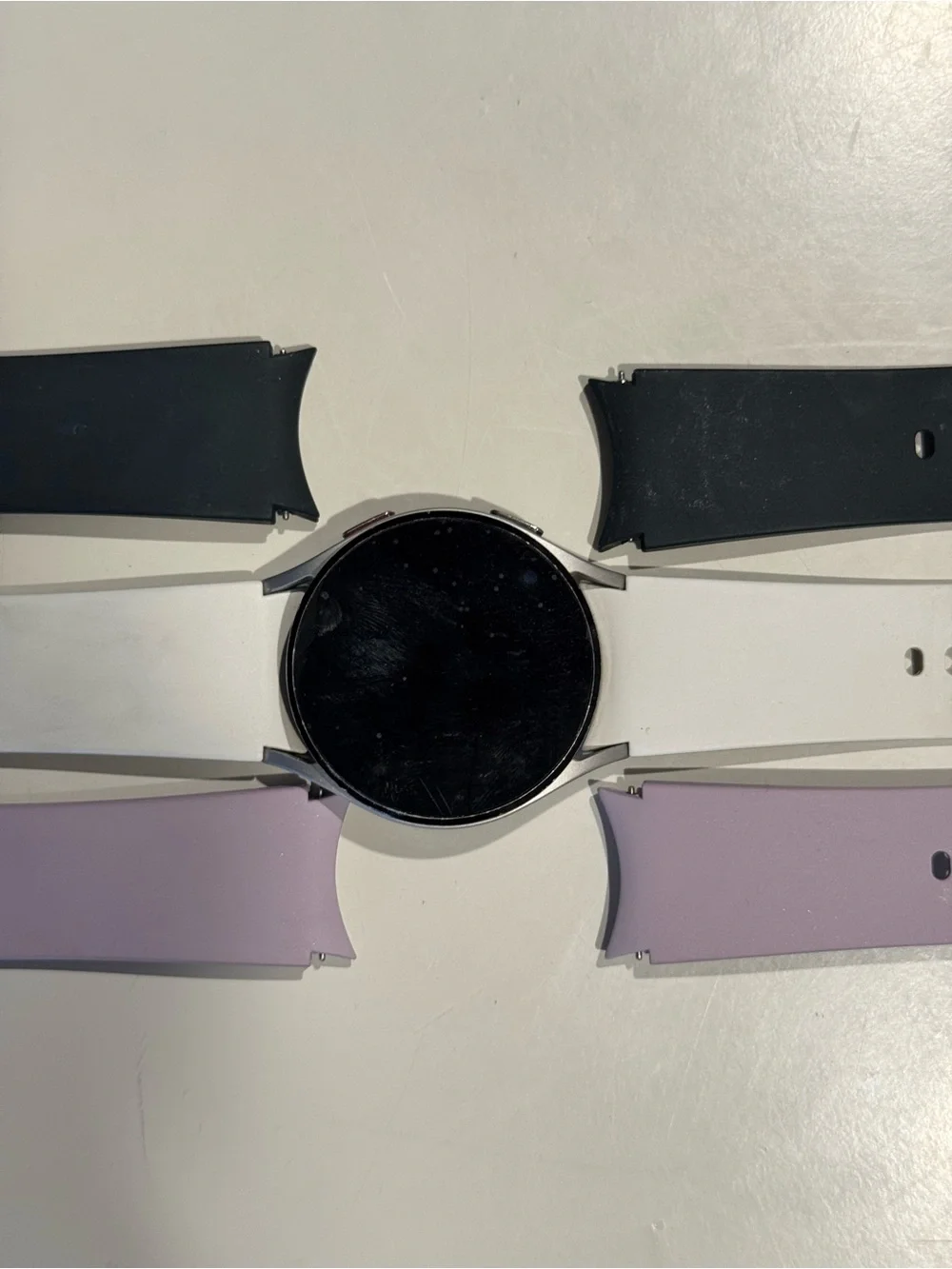 Samsung Galaxy Watch 4 - 40mm with White, Green, and Lavender Silicone Bands